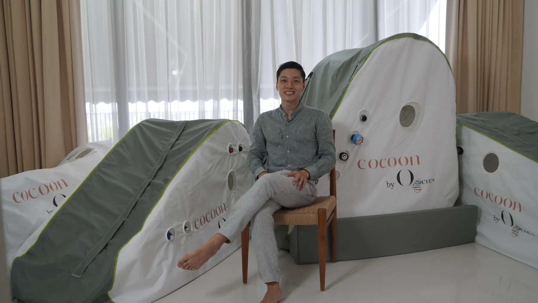 O2genes founder seated with the Soft Shell HBOT cocoon® series