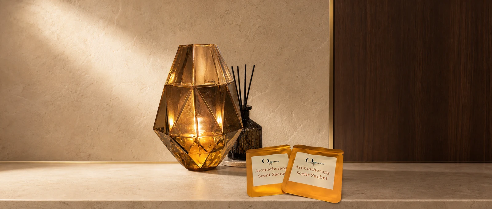 O2genes aromatherapy scent sachets beside a faceted amber lamp